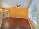 Bright living room with hardwood floors and ceiling fan at 926 Freshmeadow Ct, Apopka, FL 32703