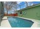 Inviting swimming pool with a screened enclosure and wooden deck at 926 Freshmeadow Ct, Apopka, FL 32703