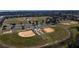 Aerial view of well-maintained baseball fields at 10136 Huntingnet Way, Leesburg, FL 34748