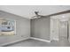 Spacious bedroom with ceiling fan and grey accent wall at 1016 W Lake Marion Rd, Haines City, FL 33844