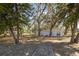 Home's exterior view with walkway and trees at 1016 W Lake Marion Rd, Haines City, FL 33844