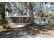 Ranch style home exterior with screened porch and walkway at 1016 W Lake Marion Rd, Haines City, FL 33844