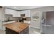 Modern kitchen with butcher block island and stainless steel appliances at 1016 W Lake Marion Rd, Haines City, FL 33844