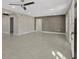 Living room featuring tile floors and a neutral color palette, leading to other areas at 1016 W Lake Marion Rd, Haines City, FL 33844