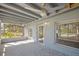 Relaxing screened porch with ceiling fans and tile floors at 1016 W Lake Marion Rd, Haines City, FL 33844