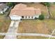 Aerial view of a ranch home with a brown roof at 102 Carriage Hill Dr, Casselberry, FL 32707