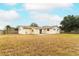 House with a large backyard and wooden fence at 102 Carriage Hill Dr, Casselberry, FL 32707