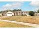 Single story home with attached garage and fenced yard at 102 Carriage Hill Dr, Casselberry, FL 32707