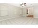 Bright living room with tile floors and a ceiling fan at 102 Carriage Hill Dr, Casselberry, FL 32707