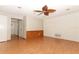 Living room with hardwood floors, brick wall, and ceiling fan at 102 Carriage Hill Dr, Casselberry, FL 32707