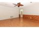 Living room boasting hardwood floors and brick accent wall at 102 Carriage Hill Dr, Casselberry, FL 32707