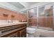 Bathroom with pink tile and a shower/tub combo at 1074 Gerona Ave, Deltona, FL 32725