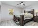 Spacious bedroom with a dark brown bed frame and ceiling fan at 1074 Gerona Ave, Deltona, FL 32725