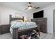 Bedroom with dark brown dresser and large TV at 1074 Gerona Ave, Deltona, FL 32725