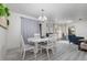 Dining area with white table and chairs, and gray flooring at 1074 Gerona Ave, Deltona, FL 32725