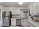 Kitchen with stainless steel appliances and white cabinets at 1074 Gerona Ave, Deltona, FL 32725