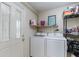 Bright laundry room with washer, dryer, and ample storage at 1074 Gerona Ave, Deltona, FL 32725