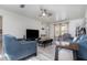 Relaxing living room, featuring hardwood floors and a large TV at 1074 Gerona Ave, Deltona, FL 32725