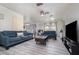 Living area with gray flooring, two sofas, and a coffee table at 1074 Gerona Ave, Deltona, FL 32725