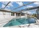 Inviting kidney-shaped pool with screened enclosure at 1074 Gerona Ave, Deltona, FL 32725