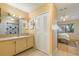 Clean bathroom with vanity, sink, and linen closet at 1098 Soria Ave, Orlando, FL 32807