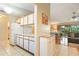 Galley kitchen with white cabinets and stainless steel appliances at 1098 Soria Ave, Orlando, FL 32807