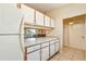 Bright kitchen features ample cabinetry and a view to the living area at 1098 Soria Ave, Orlando, FL 32807