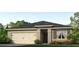 One-story house with a two-car garage, landscaping, and a neutral color scheme at 11143 Amber Ridge Dr, Zellwood, FL 32798