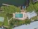 Aerial view of a large pool, boat docks, and lush trees at 1140 S Orlando Ave # J6, Maitland, FL 32751