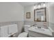 Bright bathroom featuring a granite countertop vanity and tile backsplash at 1140 S Orlando Ave # J6, Maitland, FL 32751