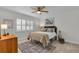 Cozy bedroom with ceiling fan, neutral walls, and lots of natural light at 1140 S Orlando Ave # J6, Maitland, FL 32751