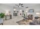 Open concept living room with gray sofas and a dining area at 1140 S Orlando Ave # J6, Maitland, FL 32751