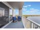 Serene balcony with lake view and comfortable seating at 13427 Blue Heron Beach Dr # 1001, Orlando, FL 32821