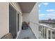 Relaxing balcony with wicker furniture and stunning city views at 13427 Blue Heron Beach Dr # 1001, Orlando, FL 32821