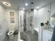 Modern bathroom with a large walk-in shower and elegant tilework at 13427 Blue Heron Beach Dr # 1001, Orlando, FL 32821