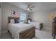 Two twin beds in a well-lit bedroom with water views at 13427 Blue Heron Beach Dr # 1001, Orlando, FL 32821