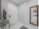 Spacious entryway with marble floors and large mirror at 13427 Blue Heron Beach Dr # 1001, Orlando, FL 32821