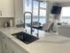 Modern kitchen with stainless steel appliances and a lake view at 13427 Blue Heron Beach Dr # 1001, Orlando, FL 32821