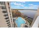 Inviting pool area with lake views and a relaxing atmosphere at 13427 Blue Heron Beach Dr # 1001, Orlando, FL 32821