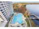 Resort-style pool with lake access and ample seating at 13427 Blue Heron Beach Dr # 1001, Orlando, FL 32821