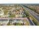 Aerial view showing townhouses near a highway at 1350 Winter Green Way, Winter Garden, FL 34787