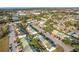 Aerial view of townhouses and surrounding neighborhood at 1350 Winter Green Way, Winter Garden, FL 34787