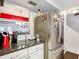 Stainless steel refrigerator in the kitchen at 1350 Winter Green Way, Winter Garden, FL 34787