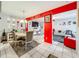 Open living area with red accents and a comfortable seating arrangement at 1350 Winter Green Way, Winter Garden, FL 34787