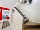 Interior view showing a carpeted staircase with a tiled entryway at 1350 Winter Green Way, Winter Garden, FL 34787