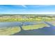 Community view with lake, houses, and boardwalk at 1551 Gateway Ln, Kissimmee, FL 34746