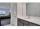 Modern bathroom with gray vanity and white countertop at 1551 Gateway Ln, Kissimmee, FL 34746