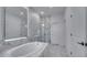 Bathroom with soaking tub and glass shower at 1551 Gateway Ln, Kissimmee, FL 34746