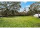 Spacious backyard with a pond view and privacy fence at 1698 Riveredge Rd, Oviedo, FL 32766