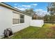 Private backyard with grassy area and white fence at 1698 Riveredge Rd, Oviedo, FL 32766